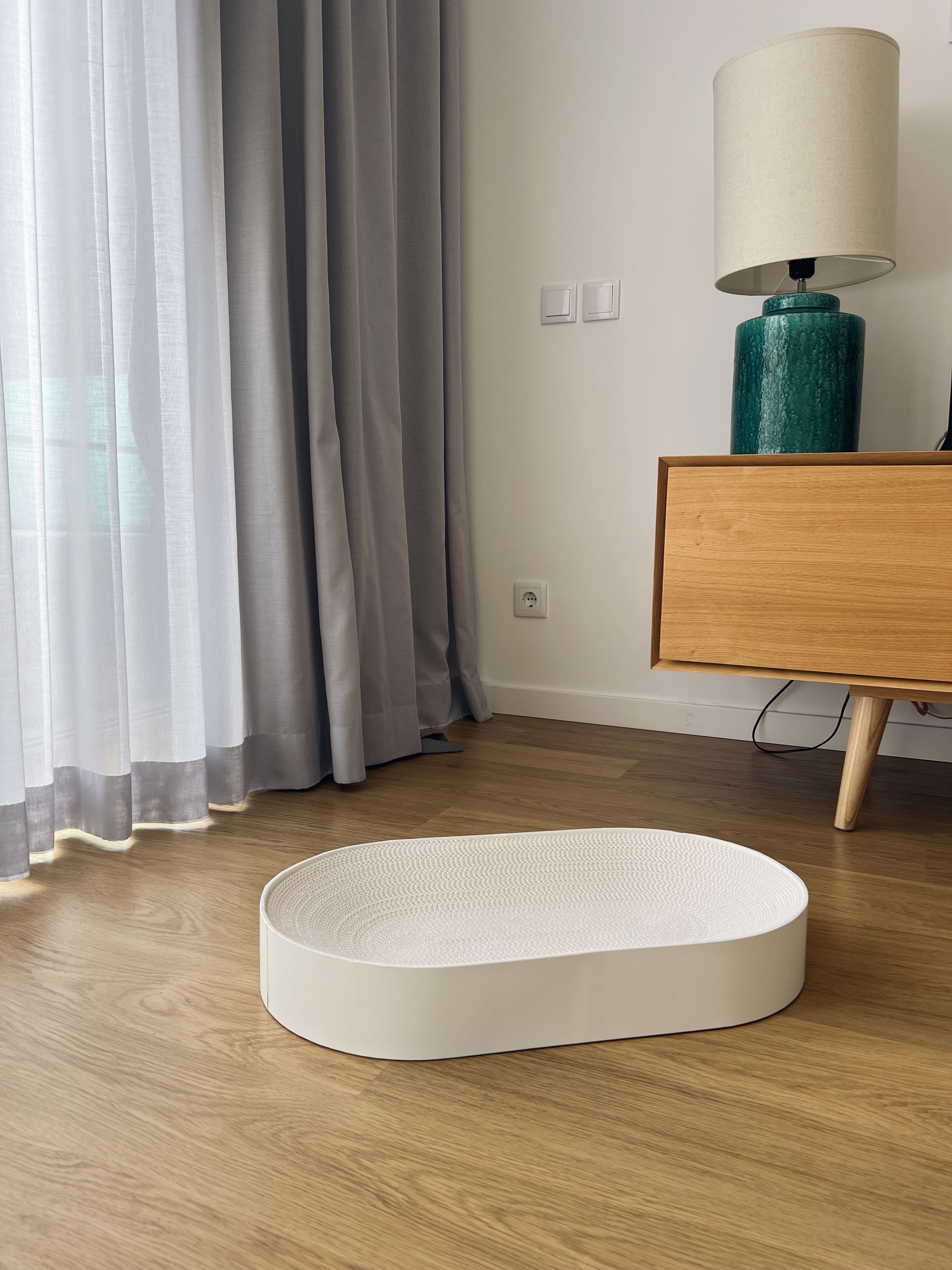 White oval cardboard cat scratcher for large cats