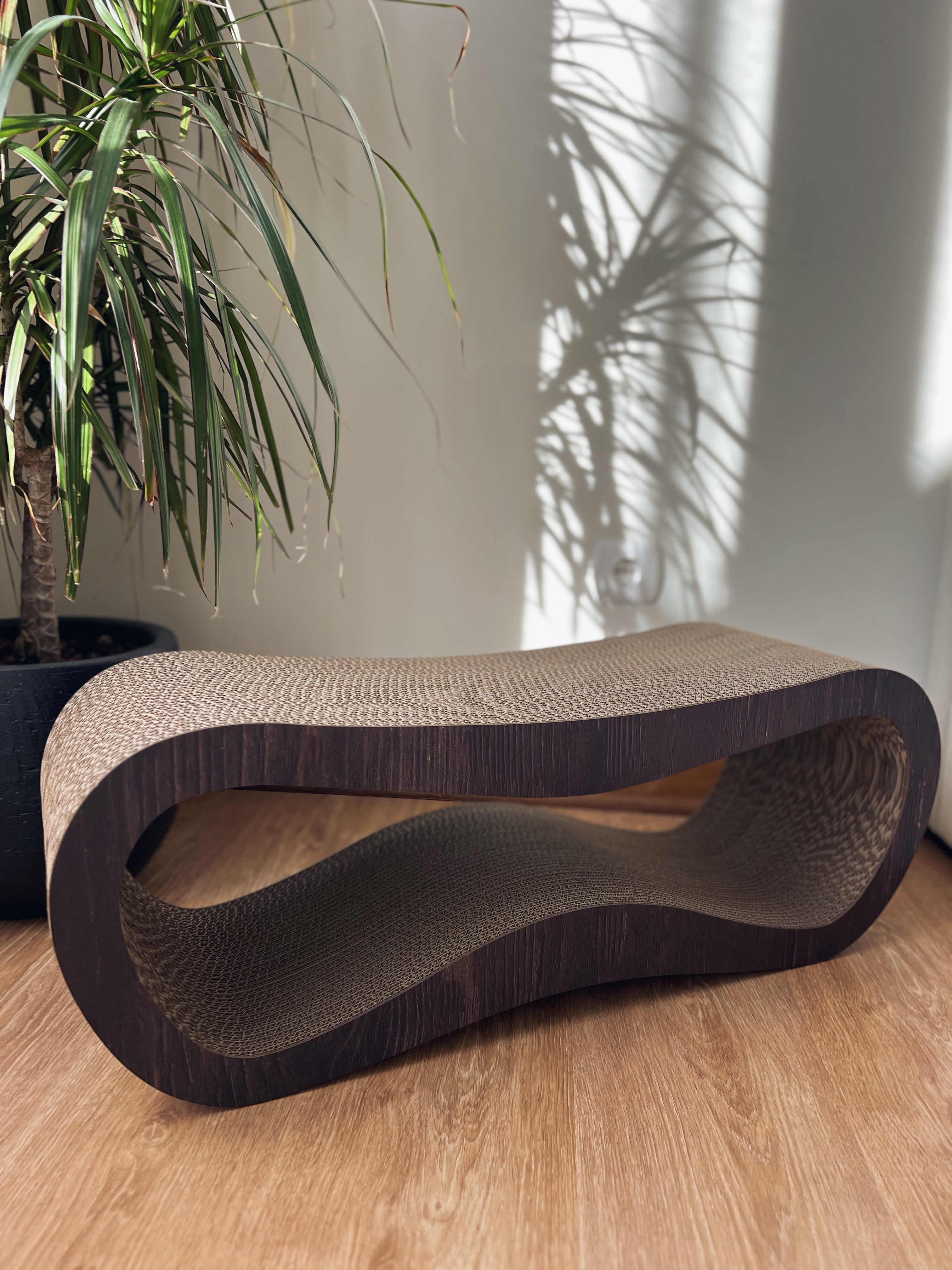 Eco-friendly cardboard cat scratcher with natural texture
