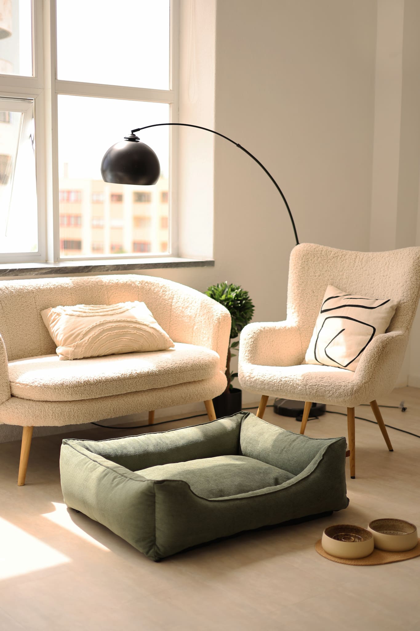 Stylish corduroy dog bed beside sofa in minimalist interior
