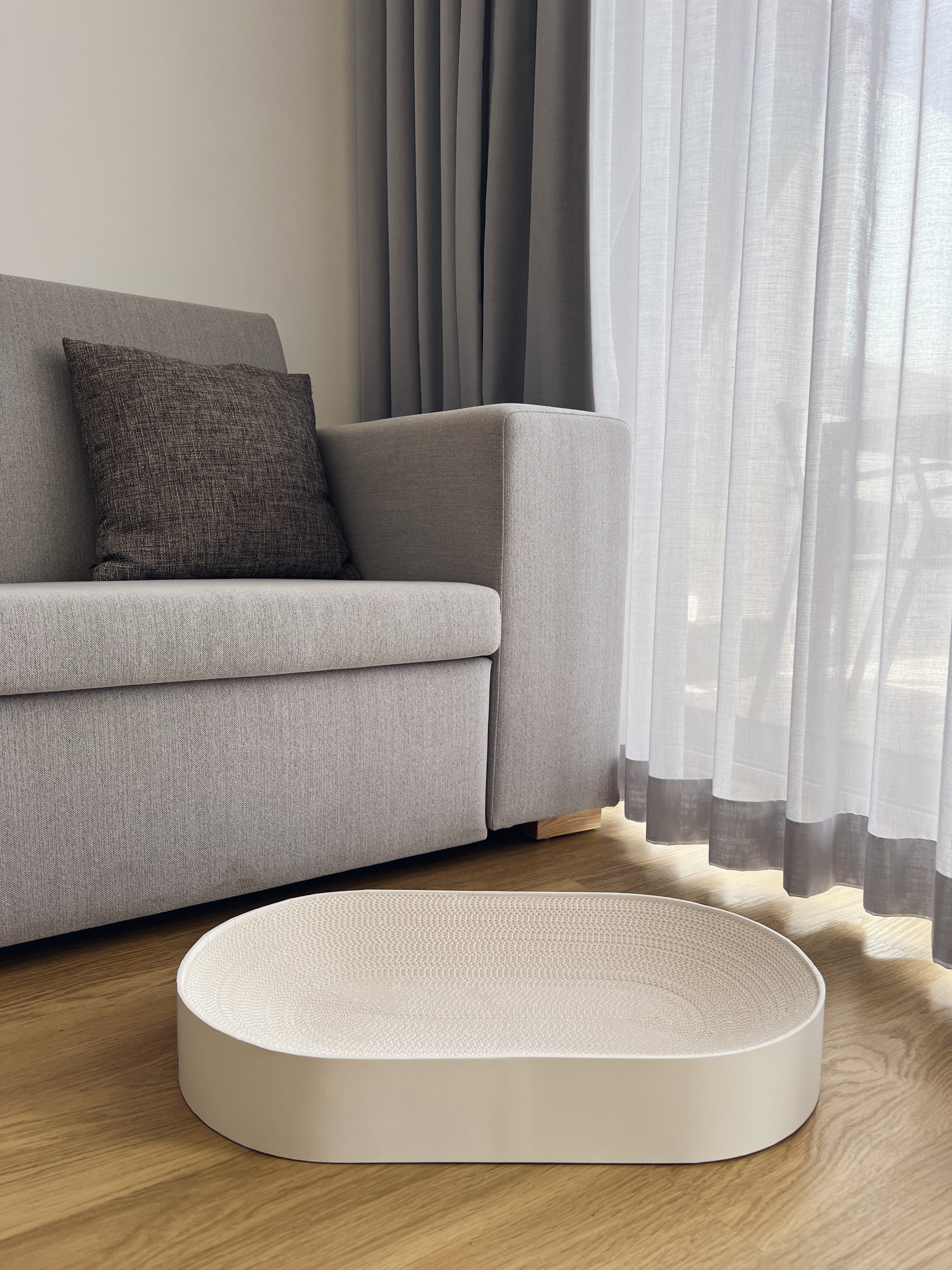 White minimalist cat scratcher and bed